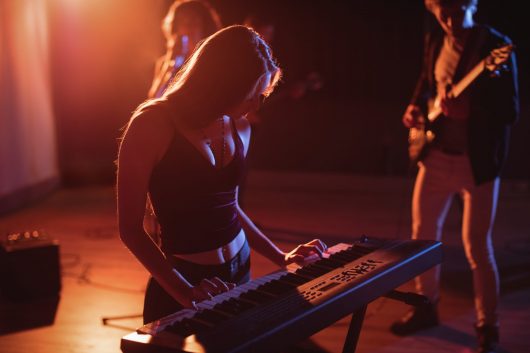 musician-playing-electronic-piano-studio