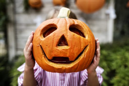 young-playful-girl-enjoying-halloween