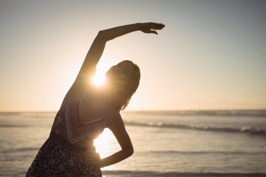 young-woman-exercising-beach